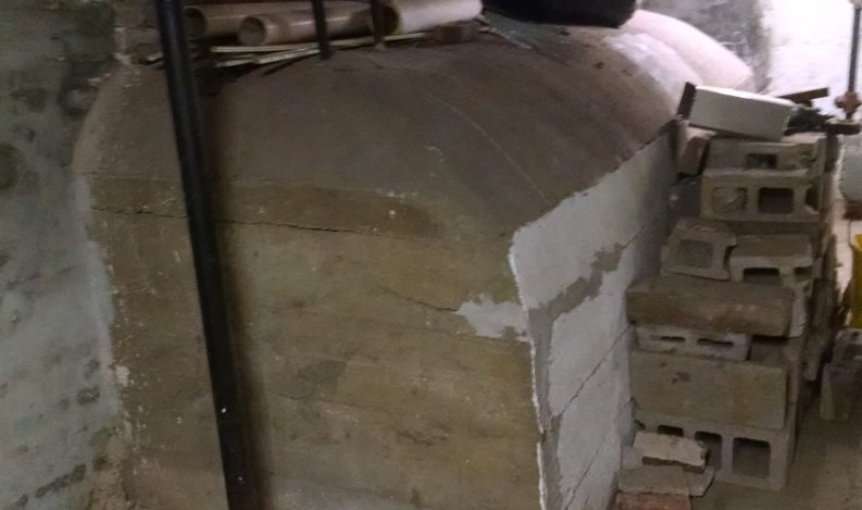 Encased heating oil tank in a NYC building basement.